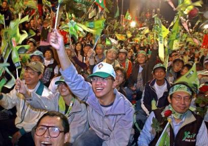 Supporters of Taiwanese President Chen Shui-bian celebrate their victory at the Democratic Progressive Party headquarters in Taipei, Taiwan, Saturday, March 20, 2004. One day after being grazed by a would-be assassin's bullet, Chen won a narrow re-election.